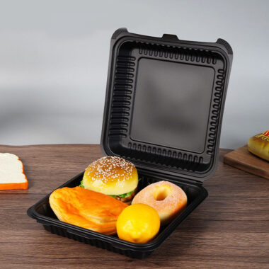 Black plastic food container with lid for restaurant takeaway