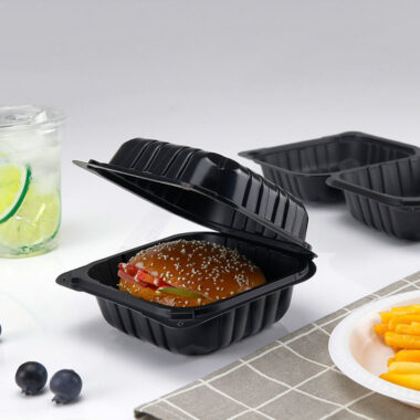Black plastic food container with lid for restaurant takeaway