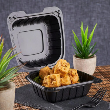 Black plastic food container with lid for restaurant takeaway
