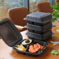 Black plastic food container with lid for restaurant takeaway