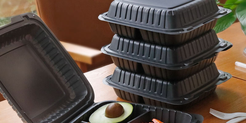 Black plastic food container with lid for restaurant takeaway